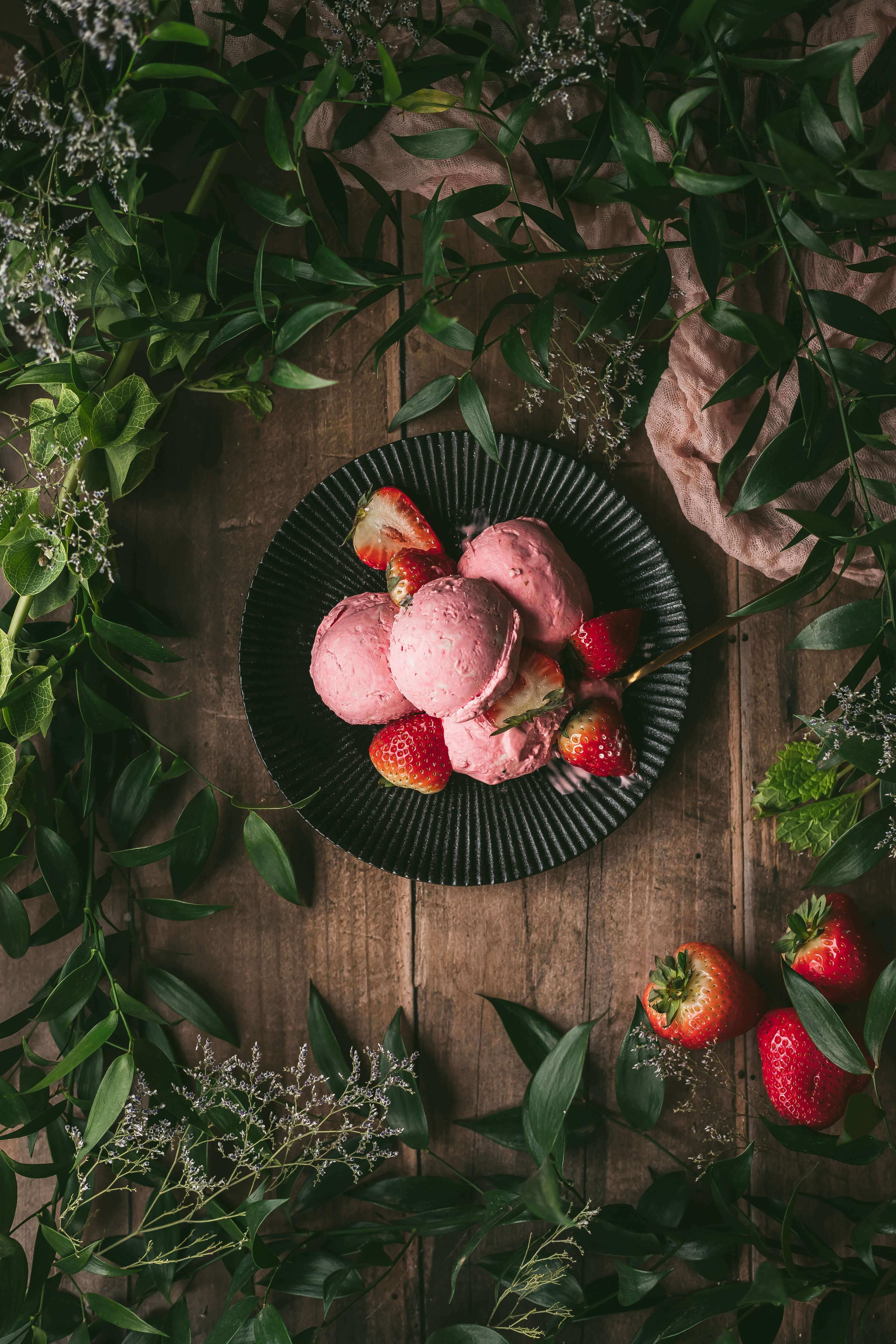 ice-cream and strawberries on a plate