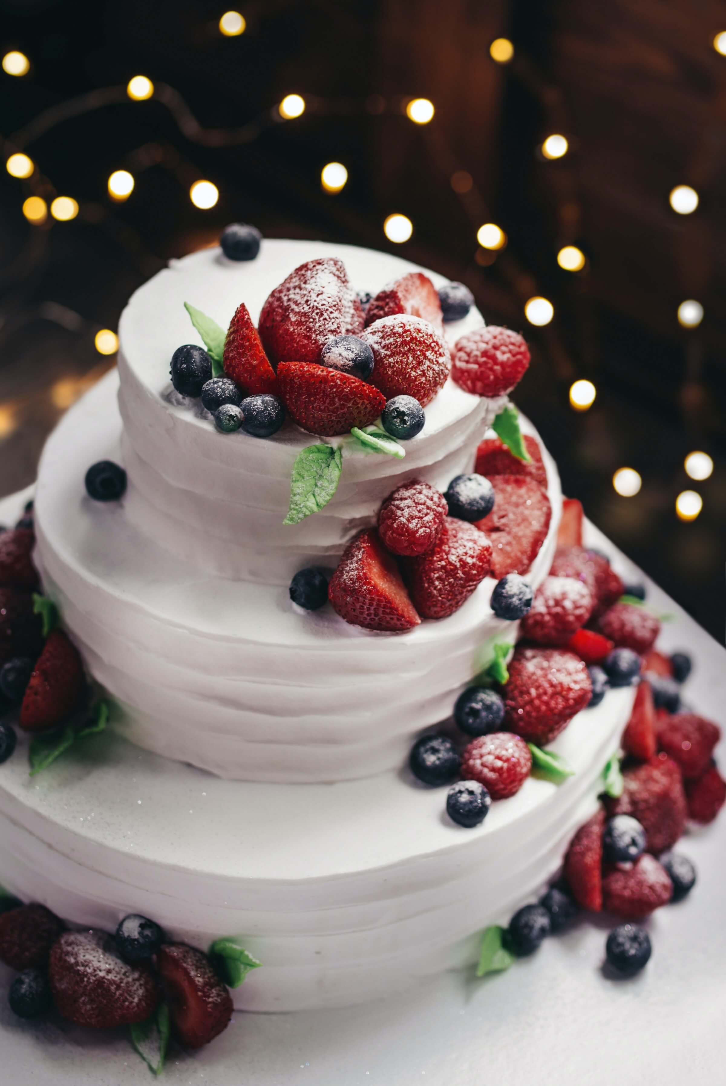 wedding cake decorated with white berries